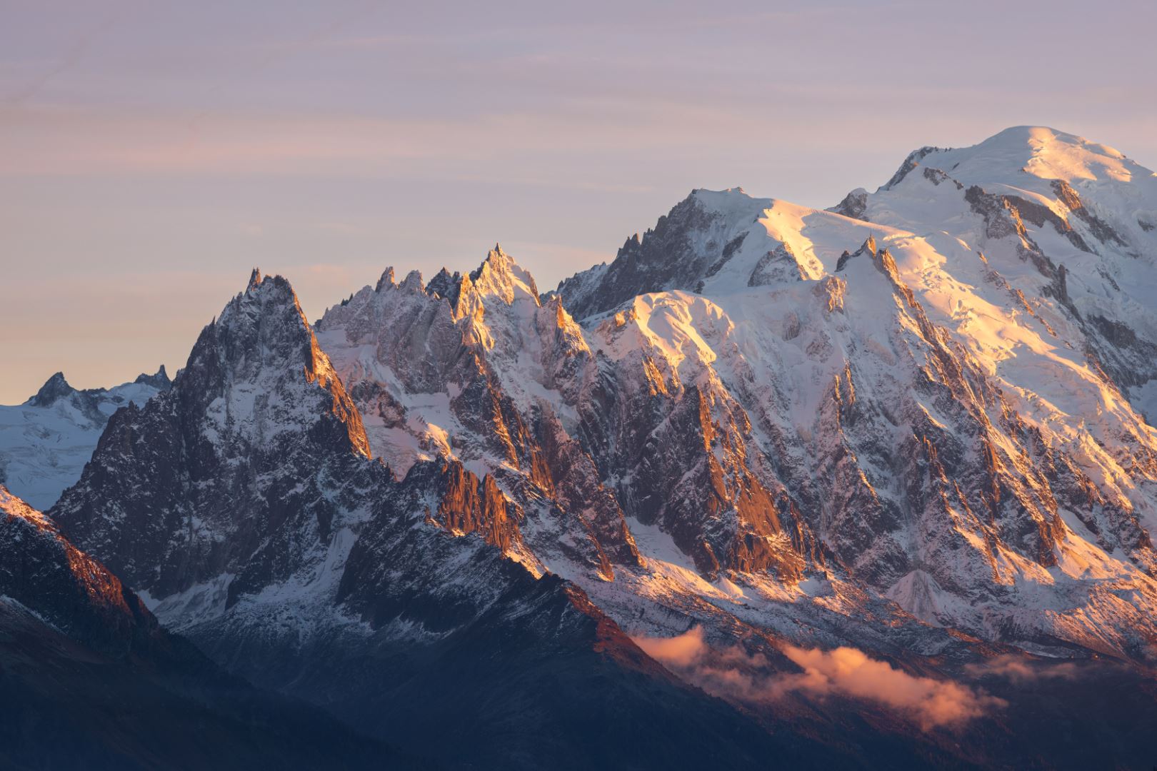 Landscape view of the snow-capped Mont-Blanc mountain massif at sunset